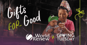 Child receiving a gift from a woman, promoting giving Tuesday and charity.