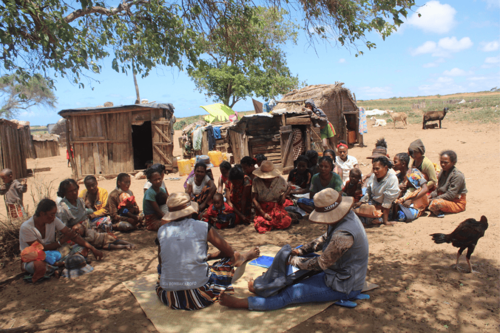 Local community gathering for a meeting in Madagascar village.