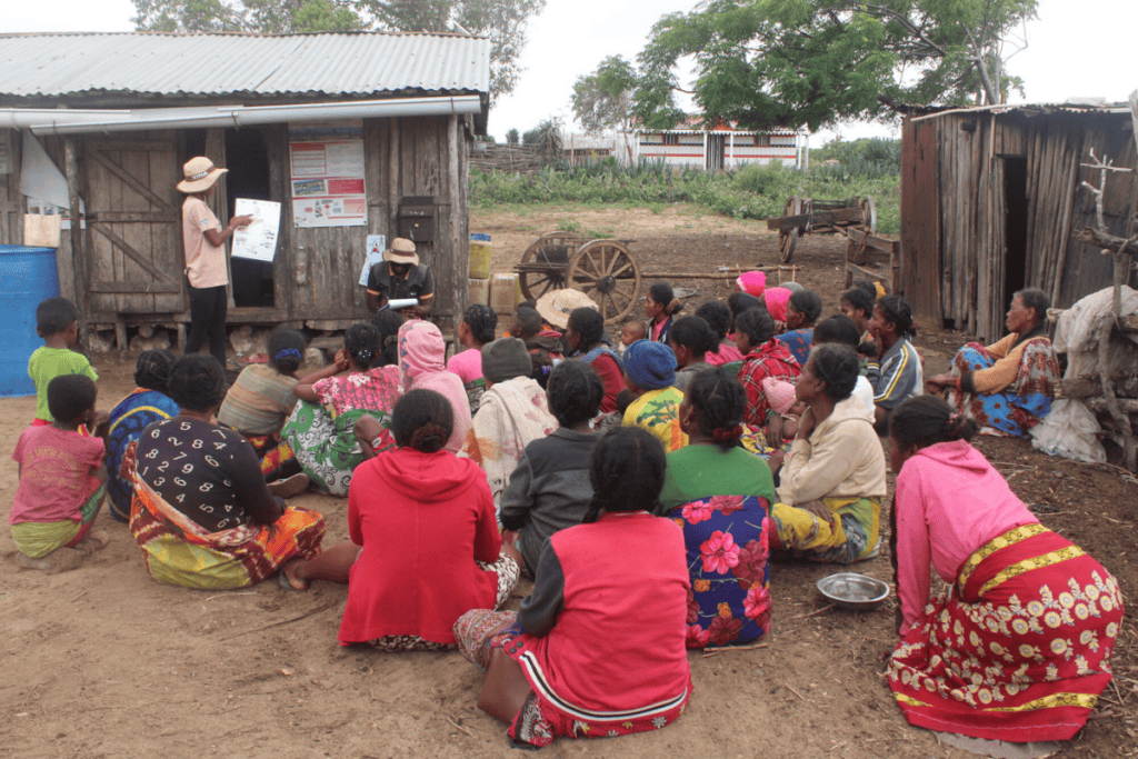 Community gathering in Madagascar for educational outreach and support.