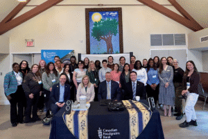 Group photo of diverse community members at World Renew event.