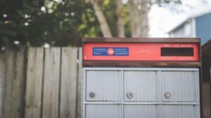 Canada Post mailbox with Canada Post logo in a residential area.