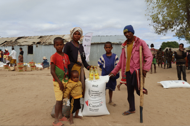 Community members receiving aid from World Renew in a rural setting.