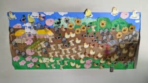 Colorful mural depicting farm animals and nature scenes for community outreach.