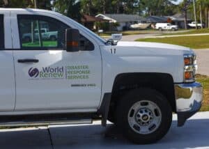 Disaster response vehicle with World Renew logo and services.