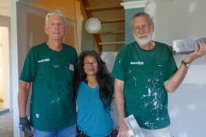 Volunteers painting a home after Hurricane Helene in Florida.