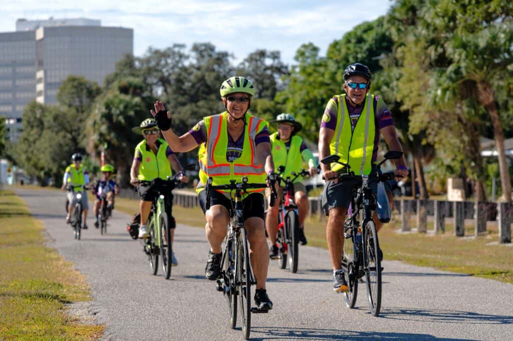 Group of cyclists participating in Ride to Renew event for charity.