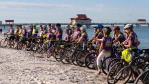 Cyclists participating in the Ride to Renew event on the beach.