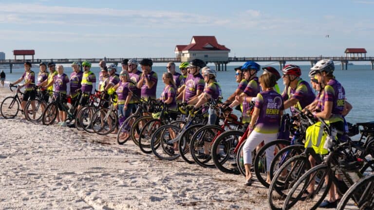 Cyclists participating in the Ride to Renew event on the beach.