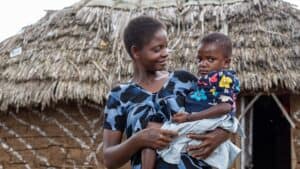 Mother prioritizing good health for her child through maternal and child health programming
