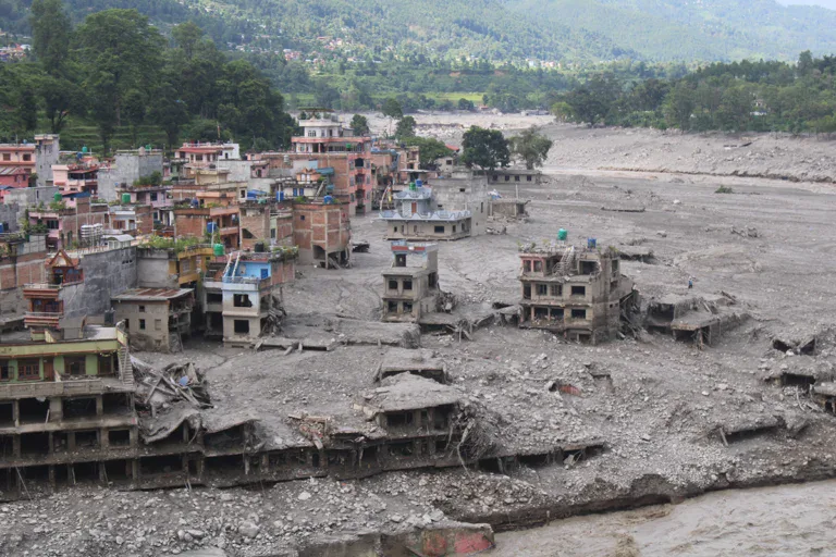 Colourful Nepalese buildings are hollowed out and flooded due to monsoons.