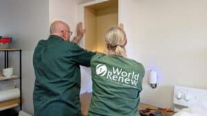 World Renew volunteers install kitchen cabinets in a hurricane-damaged home in Florida.